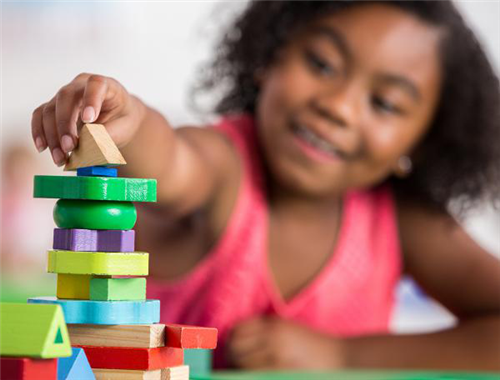 girl playing with blocks